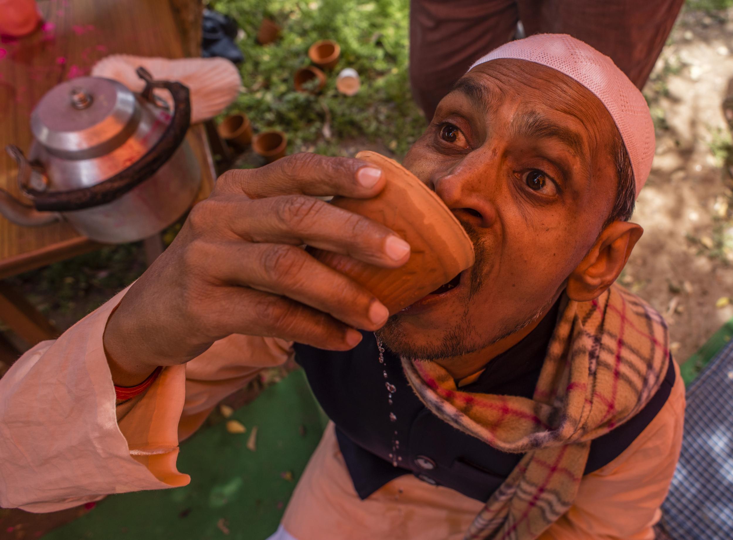 A man in New Delhi drinks cow urine to ward off Covid-19, following the advice given by a lawmaker in Modhi’s right-wing Hindu nationalist party (Getty)