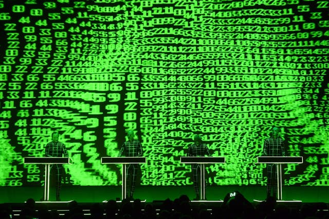 German electronic music band Kraftwerk ("power station") performs in front of a 3D video installation