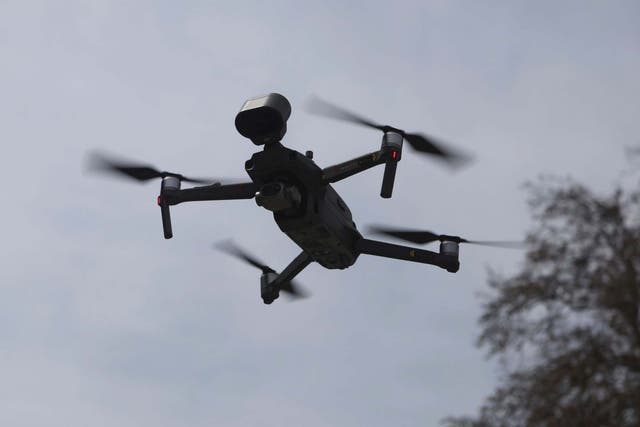 A drone hovers in air to announce restrictions, so that citizens stay indoors in Srinagar, Kashmir, India