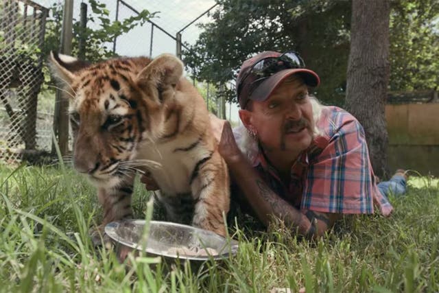 Joe Exotic with a tiger cub in the Netflix documentary 'Tiger King'