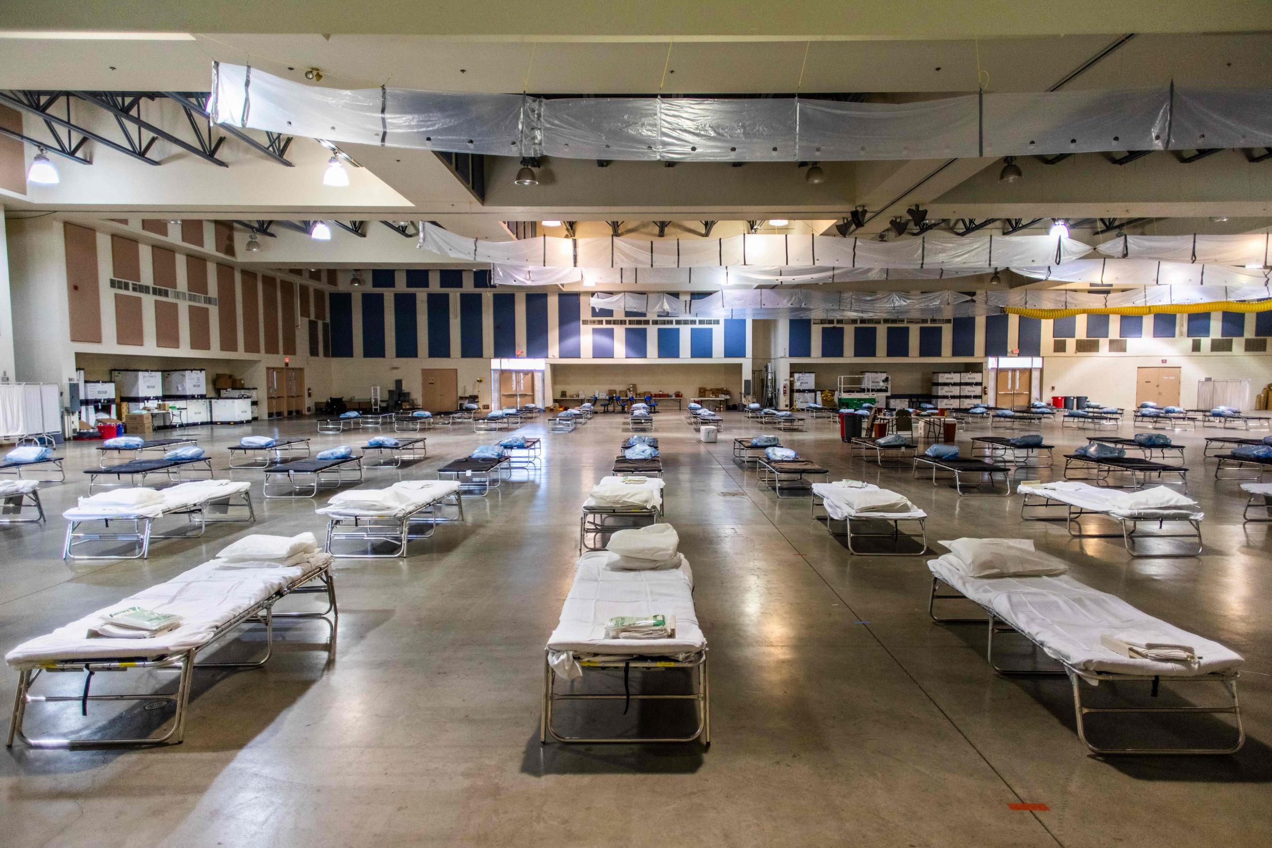 Temporary hospitals, like this one in California, have been set up all over the US and will not allow family visits