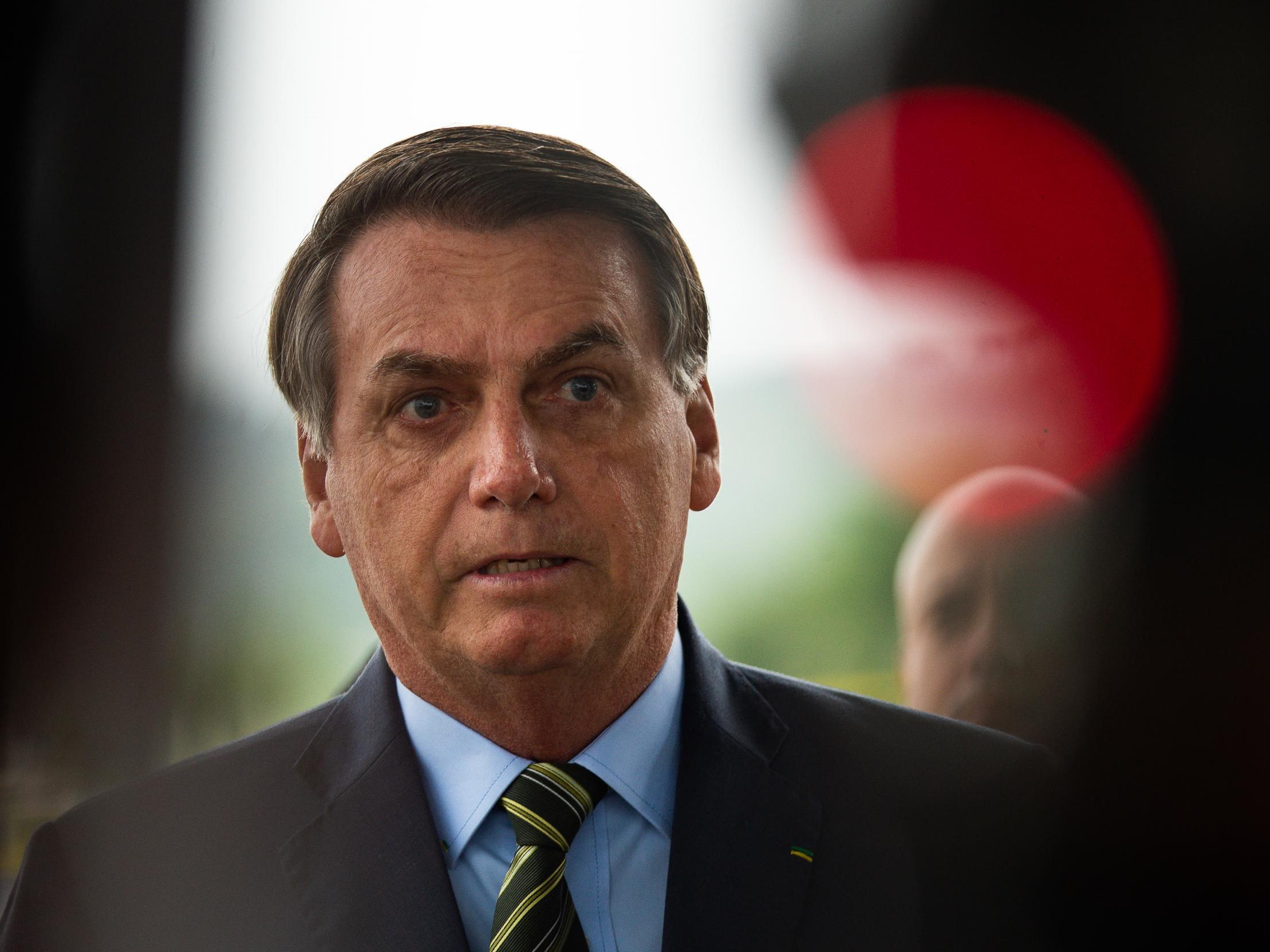 Coronavirus: Jair Bolsonaro threatens to fire health minister after clashing over Brazil's containment strategy