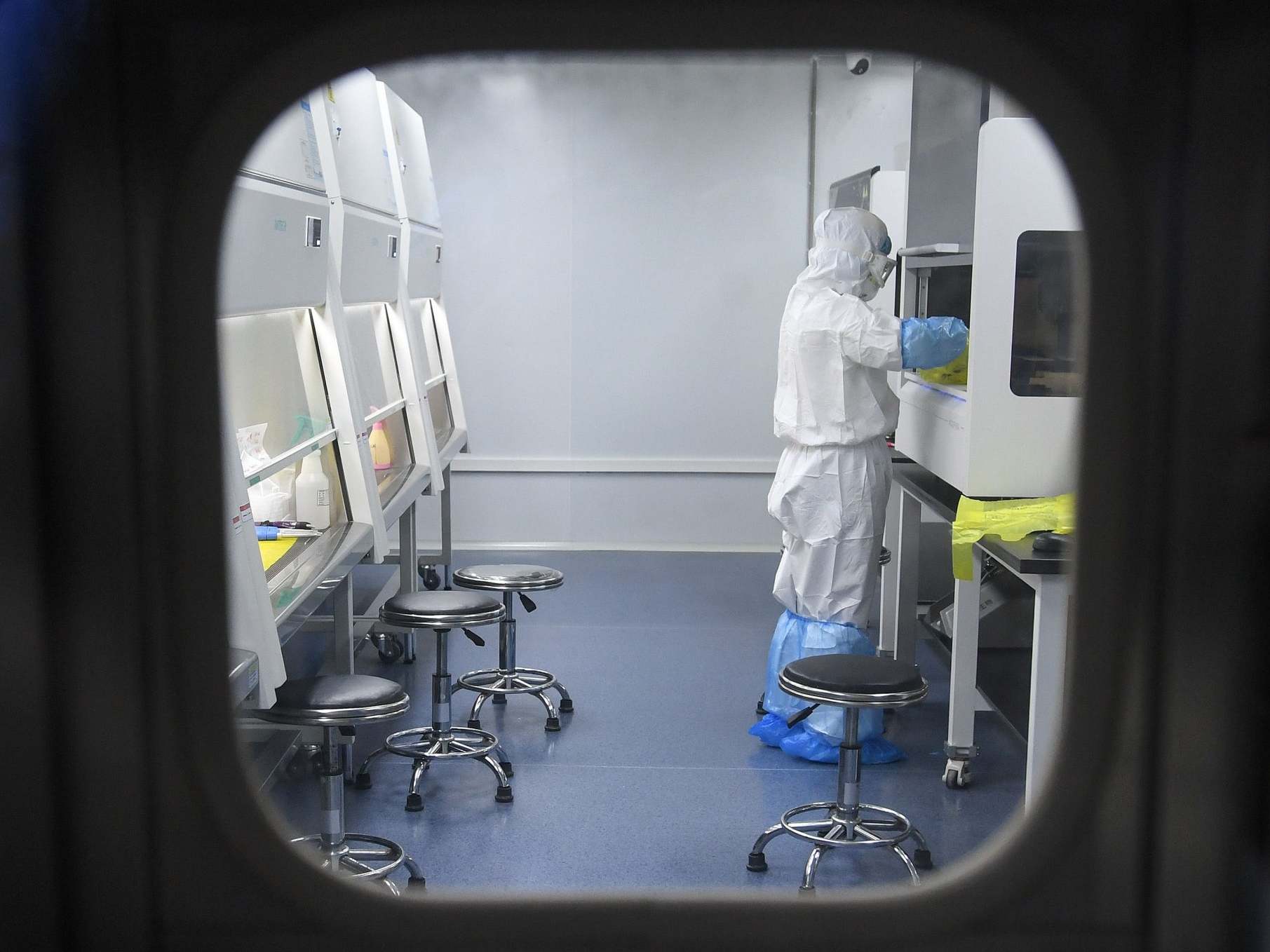 A scientist works on test samples at the 'Fire Eye' laboratory in the Chinese city of Wuhan.