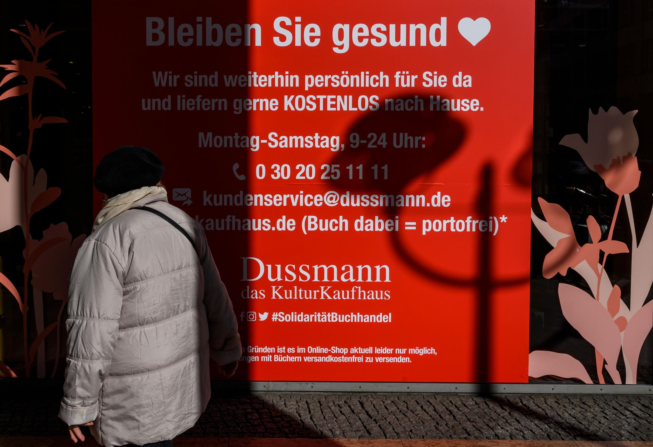 A bookstore offering free delivery to their customers sports a sign in their window reading: "Stay Healthy!" in Berlin's Mitte district on 25 March 2020.