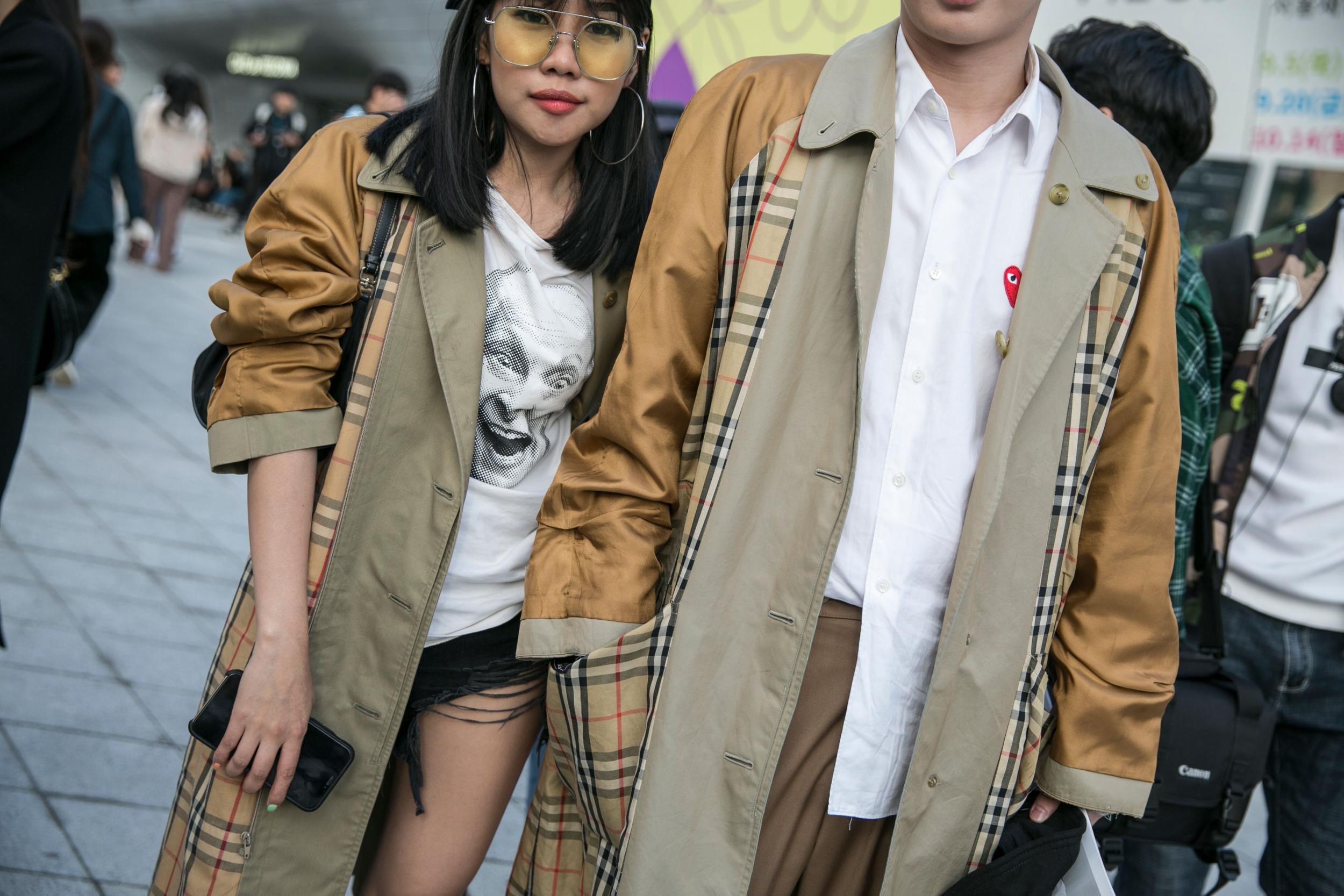 Guests wearing Burberry trench coats at Seoul Fashion Week in 2019