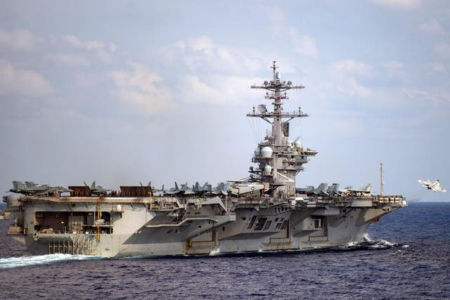 The nuclear aircraft carrier is currently docked in Guam