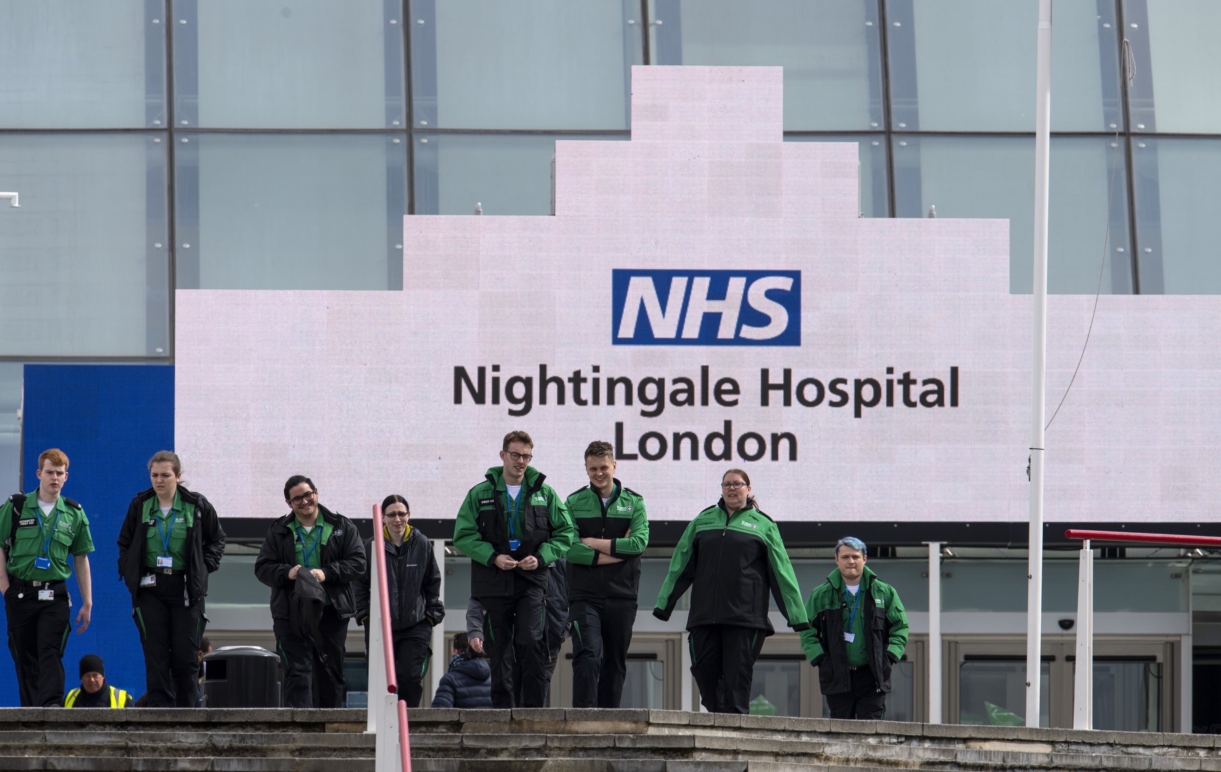 St Johns Ambulance staff leave the NHS Nightingale hospital at the Excel centre