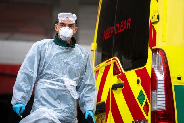 A London Ambulance worker wearing PPE at St Thomas' Hospital in London as the UK continues in lockdown to help curb the spread of the coronavirus, 1 April 2020.