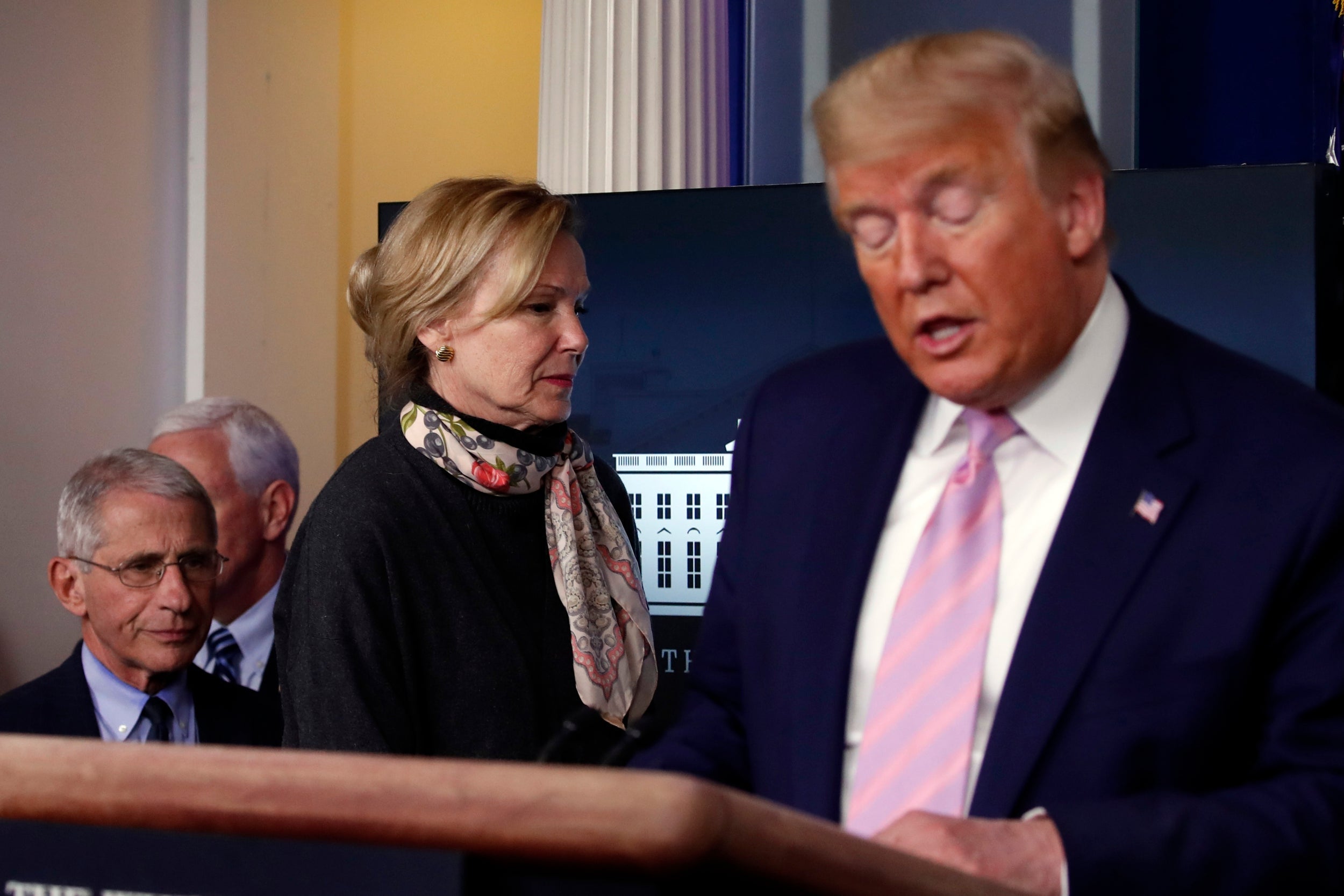 Donald Trump speaks at a White House coronavirus briefing as Deborah Birx and Anthony Fauci step on to the stage behind him