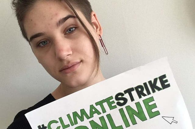 Isabelle Axelsson, one of hundreds of young demonstrators posting photos of themselves online using the hashtag #ClimateStrikeOnline, after Greta Thunberg encouraged youngsters to take their protests to Twitter rather than the streets amid the coronavirus outbreak.