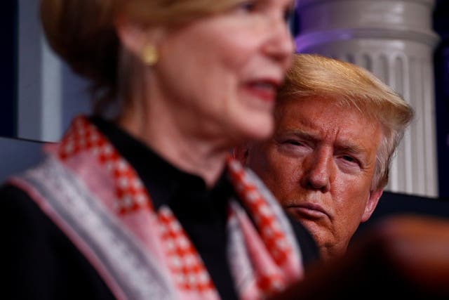 Donald Trump looks on as Deborah Birx warns Americans again to keep their distance.