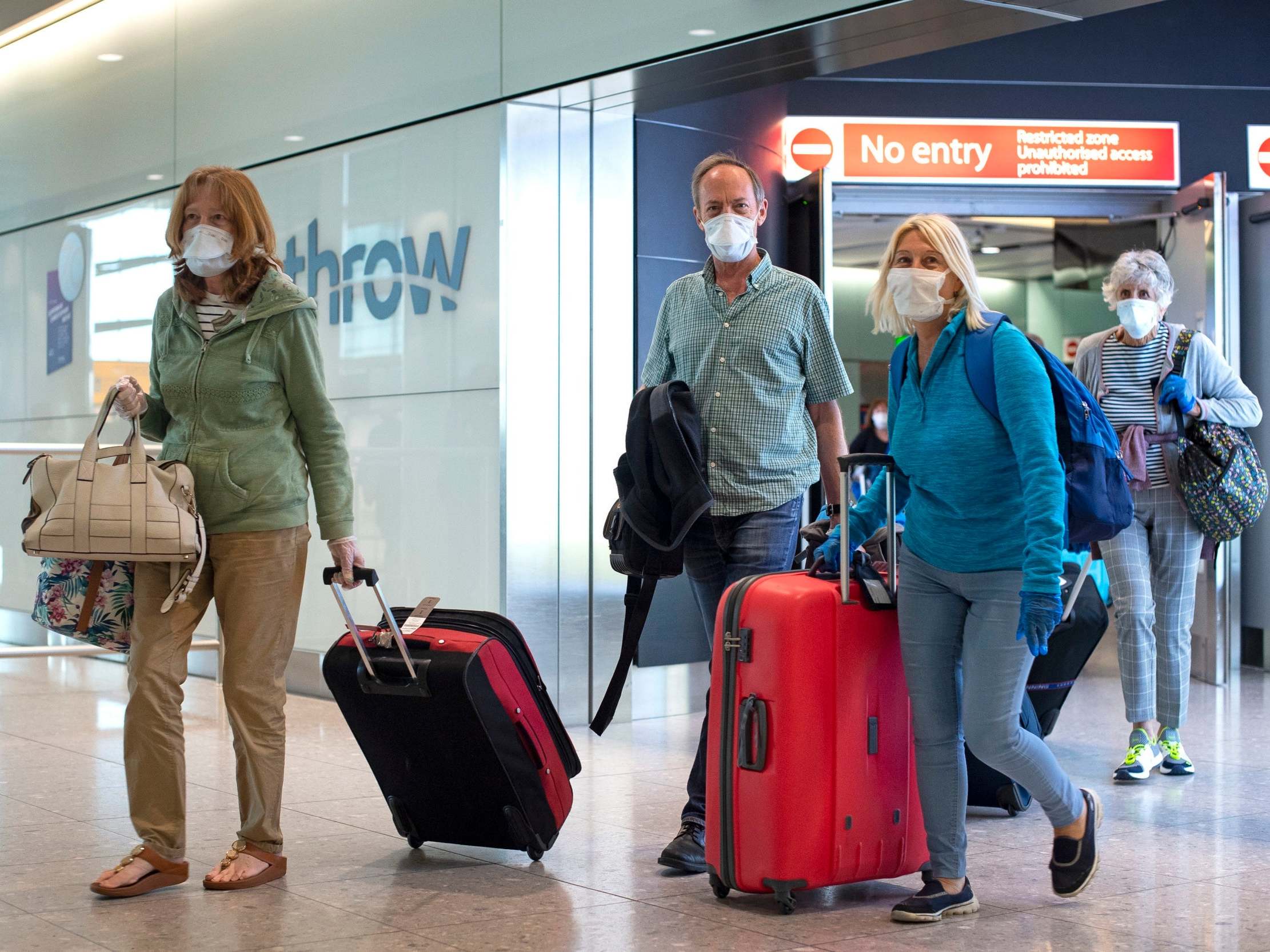 Passengers from the cruise ship Zaandam arrive at Heathrow Airport in London