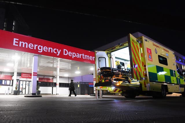 An ambulance is parked outside St Thomas' Hospital in London, Britain, 26 March 2020.