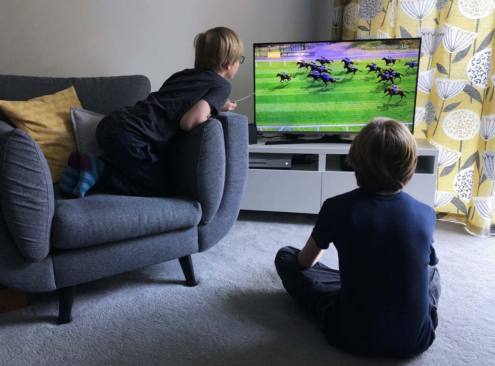 Children watch the race in Wallington, UK