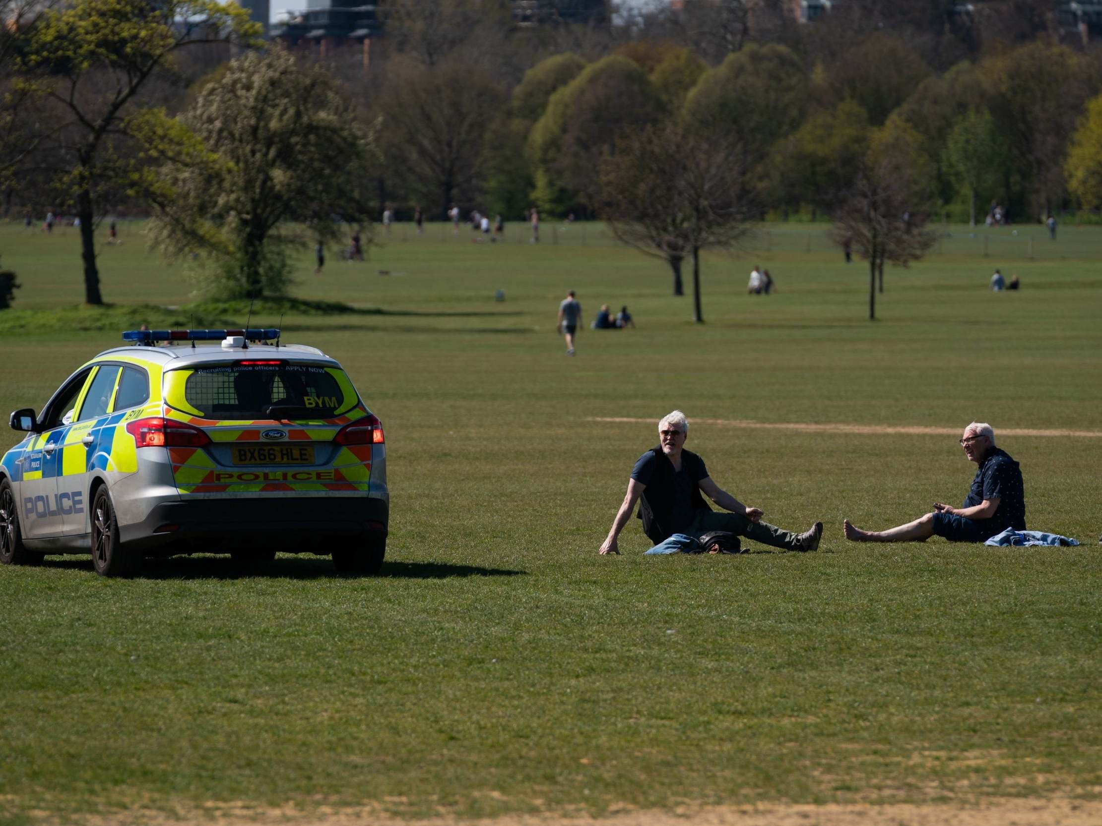 Police move on sunbathers in Regents Park, London, as the UK continues in lockdown to help curb the spread of the coronavirus