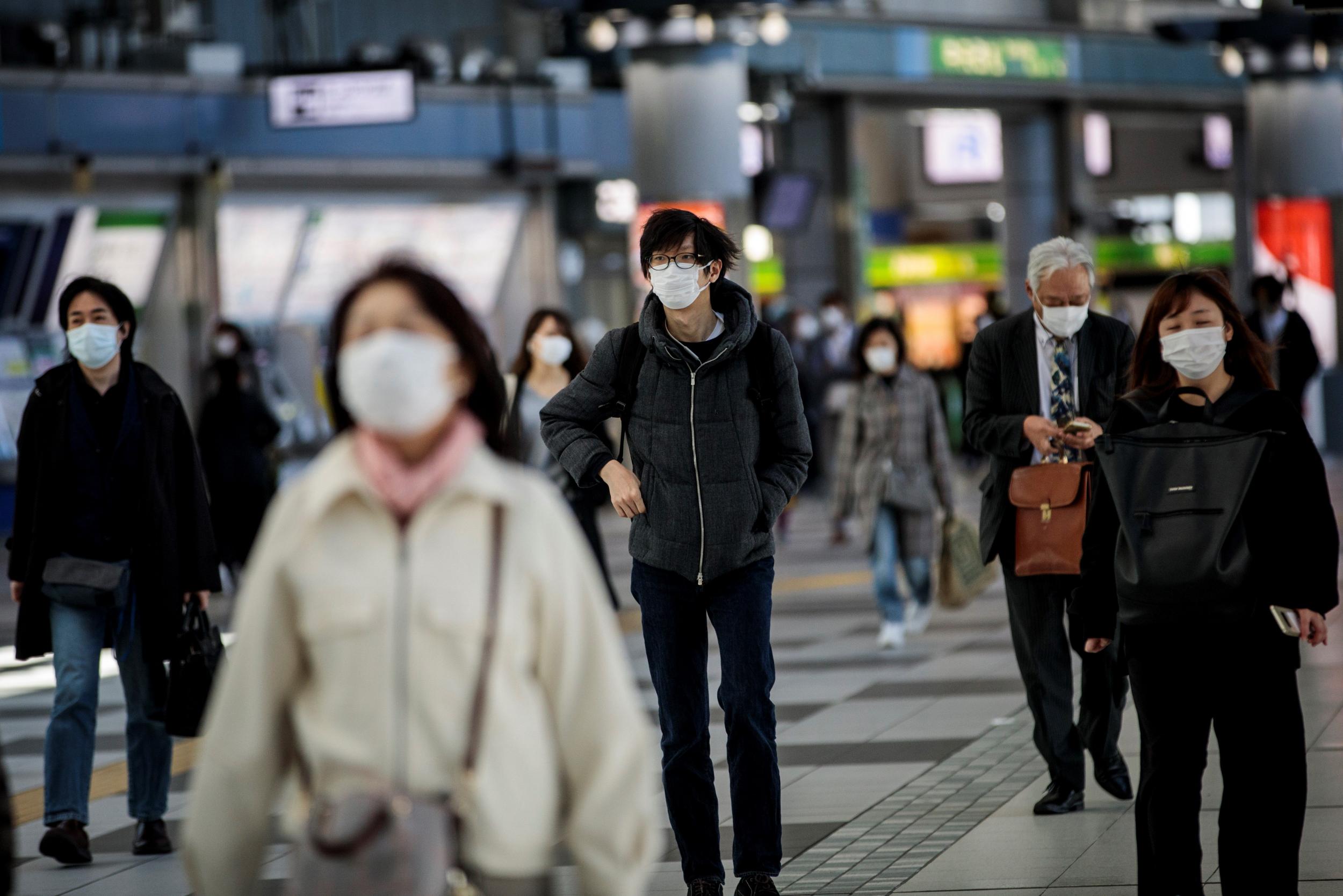 Commutes are still busy in the Japanese capital despite concerns the virus is spreading