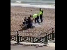 Police pour water over BBQ after beach-goers ‘refuse to leave’