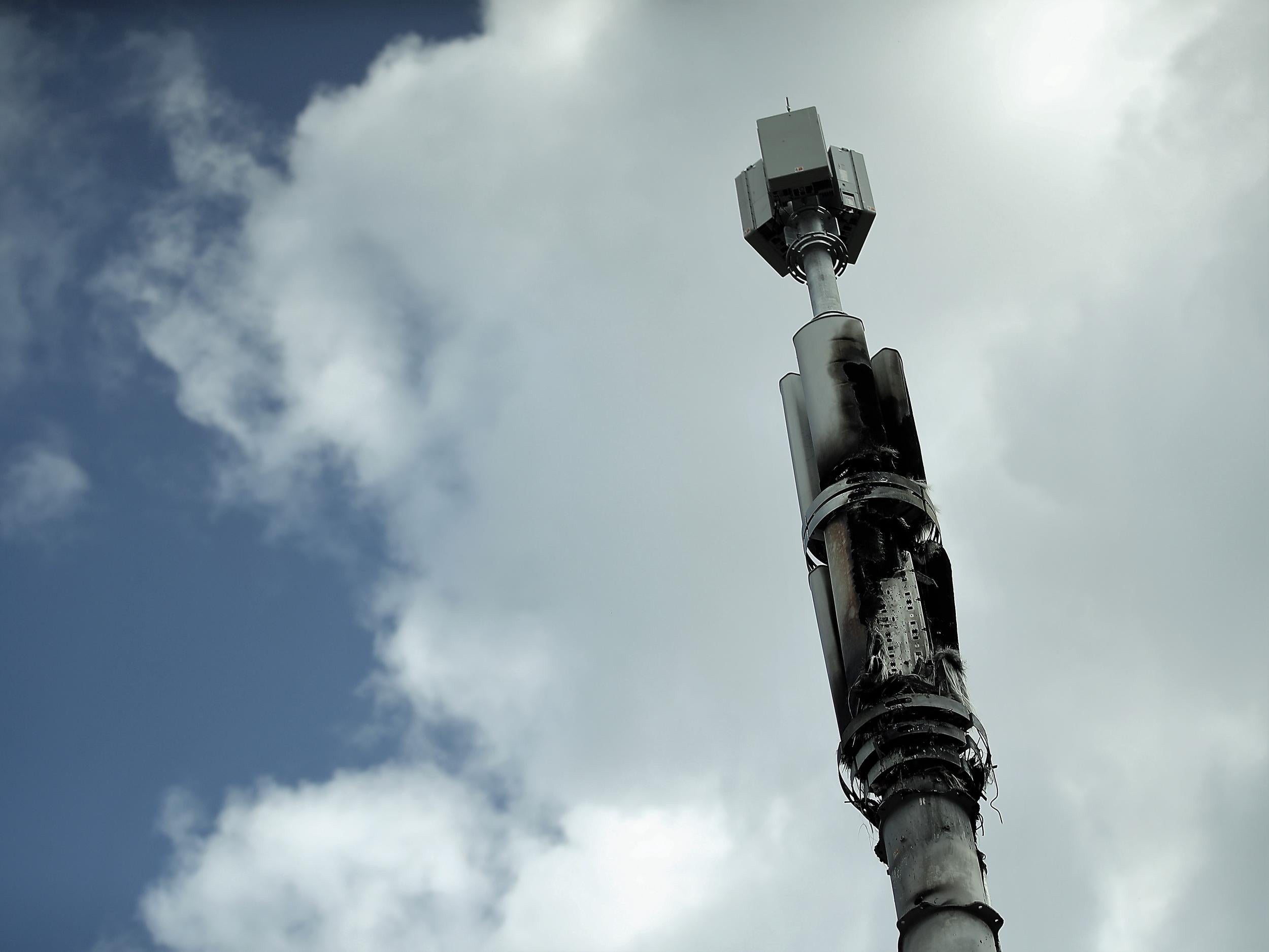 A telecommunications mast damaged by fire is seen in Birmingham amid conspiracy theories linking the coronavirus disease and 5G masts, 6 April, 2020