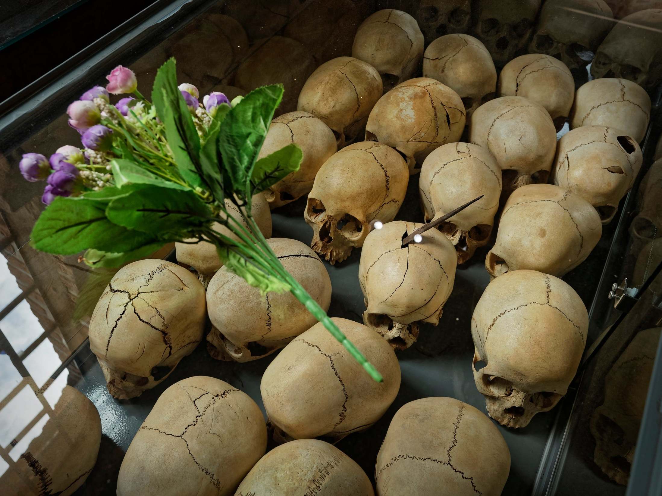 Flowers were laid on a glass case containing the skulls of some of those killed in the genocide at last year's memorial