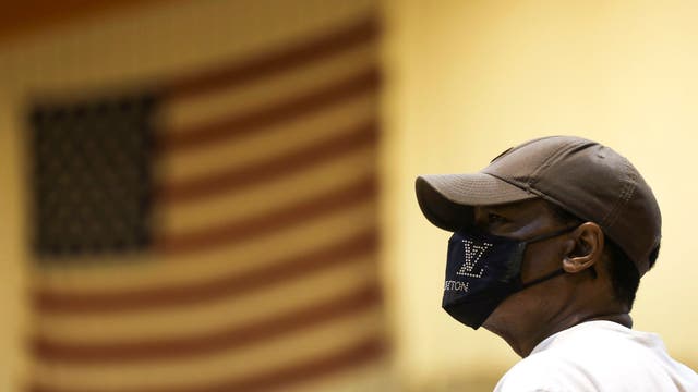 Steve Merriweather waits to vote inside Riverside University High School during the Wisconsin primary