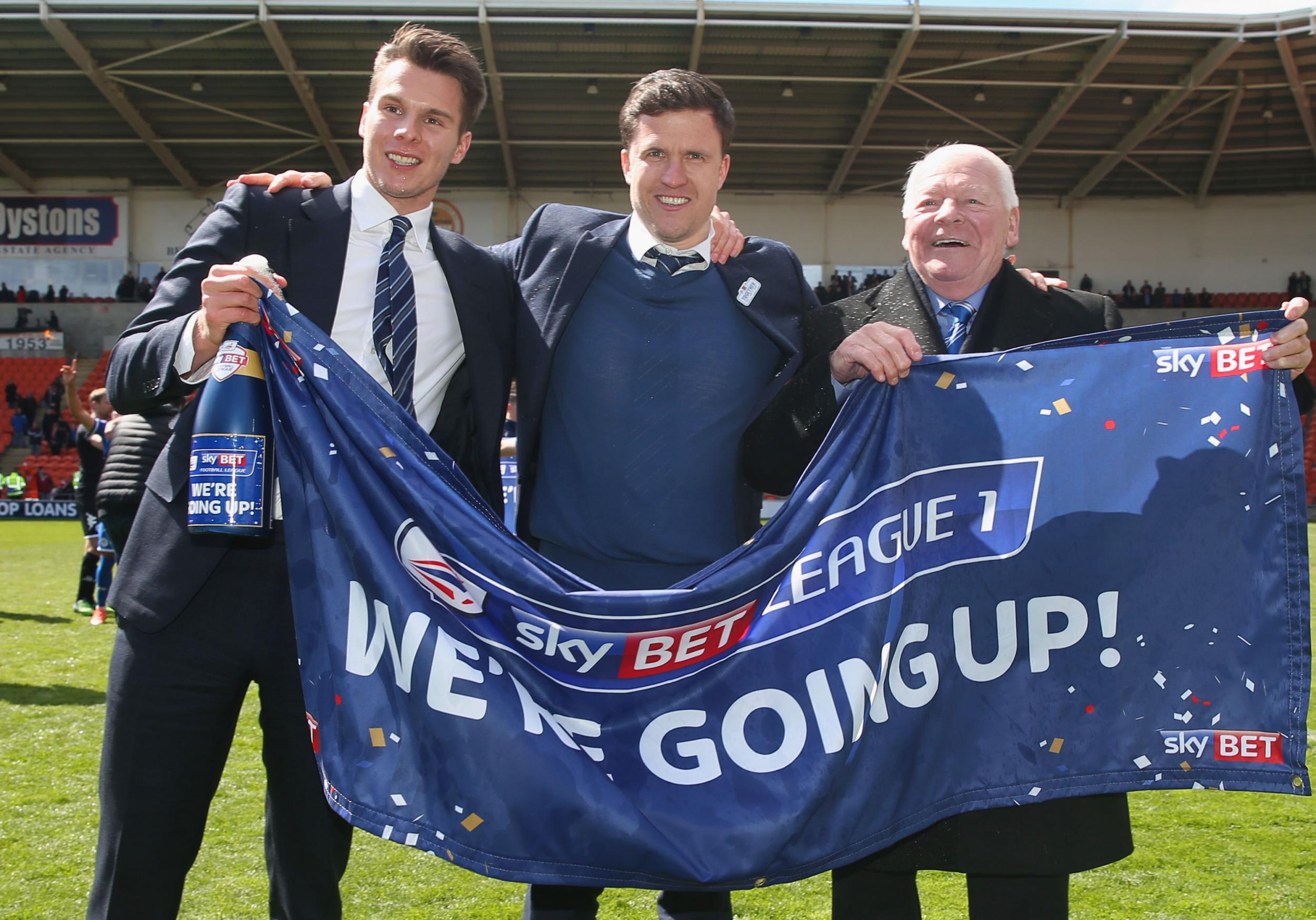 Sharpe (left) sold his boyhood club Wigan in late 2018