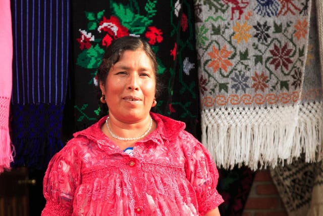 A seller with her knitted wares near the town of Angahuan, one of the many places to find beautiful objects