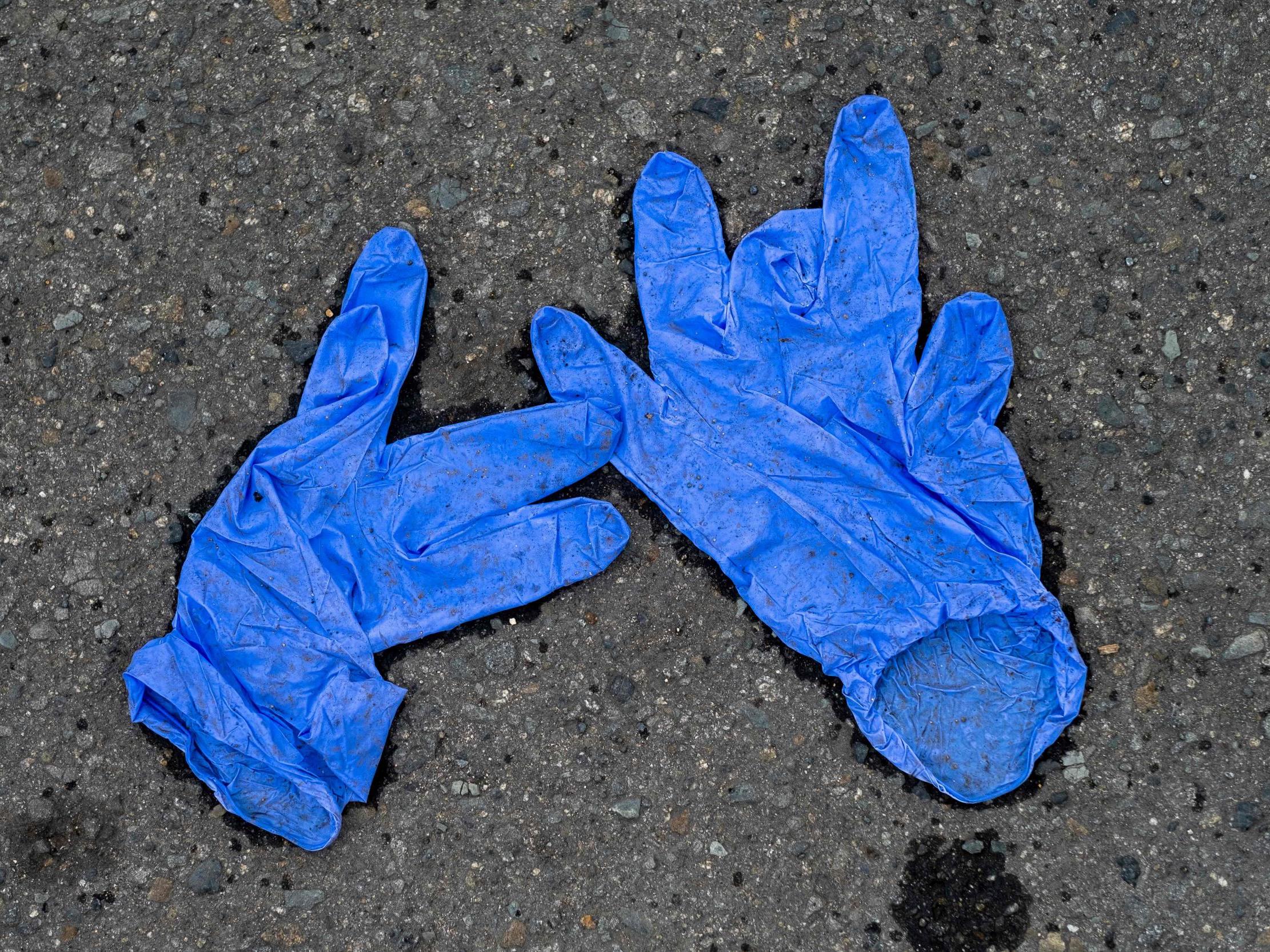 Latex gloves left outside of a grocery store