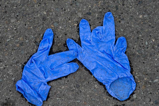 Latex gloves left outside of a grocery store