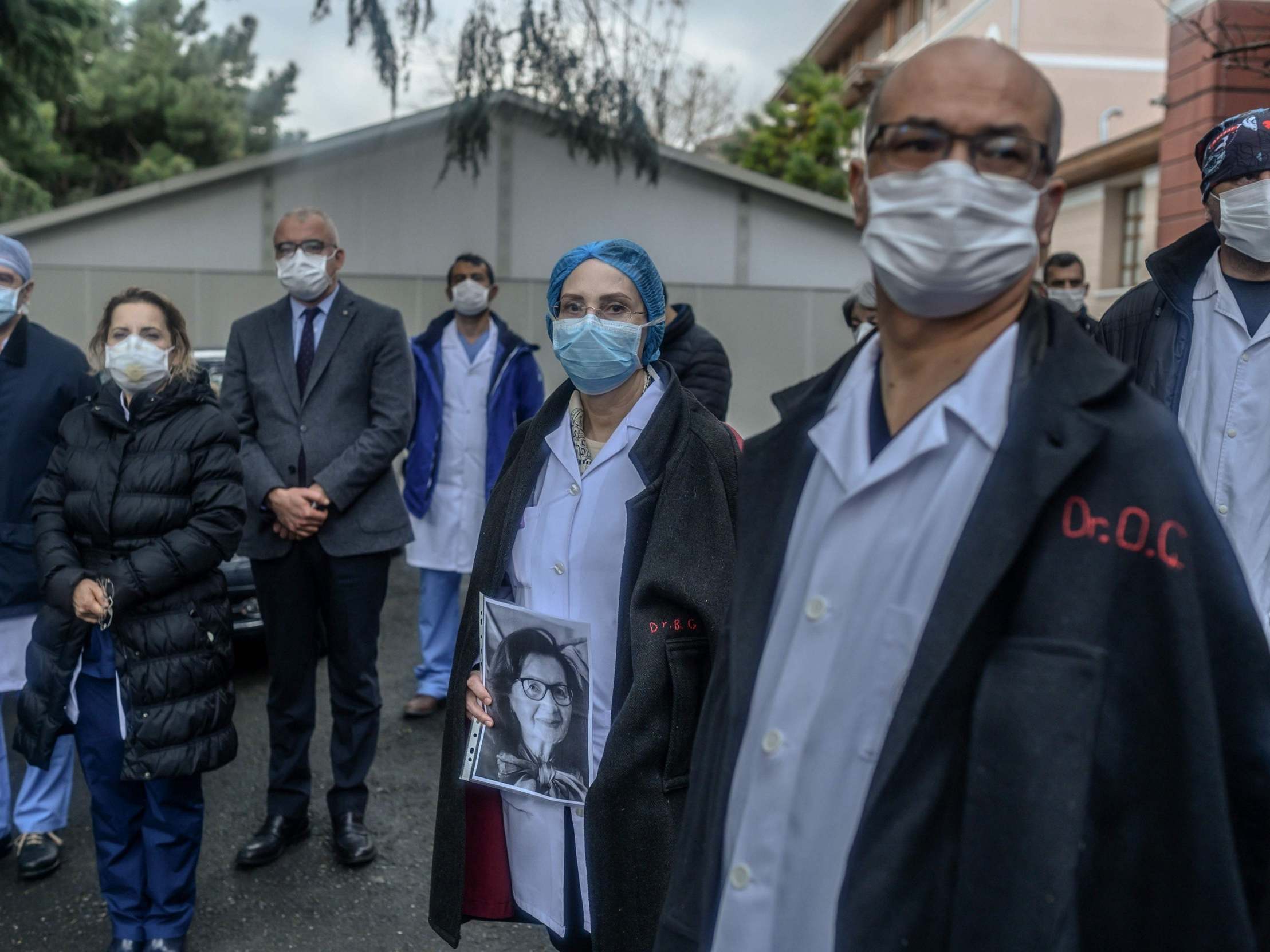 Members of the Cerrahpasa Faculty of Medicine in Istanbul hold a minute’s silence for a retired colleague killed by the coronavirus