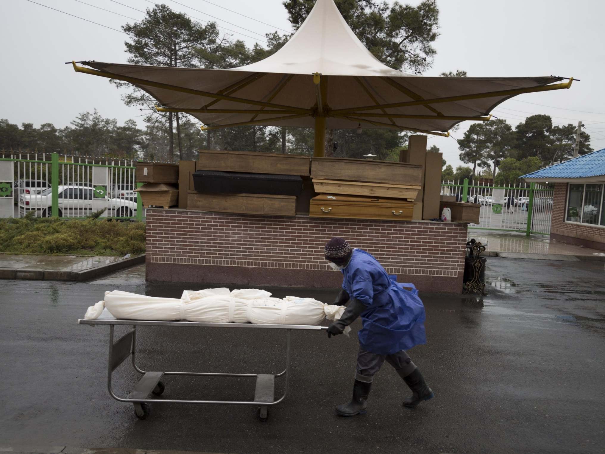 Morticians prepare the bodies of Covid-19 victims for burial in Tehran, Iran