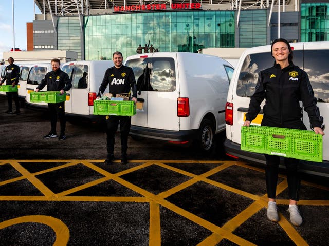 Manchester United Foundation and club staff package up 30,000 items of food and drink to deliver to Stretford Food Bank