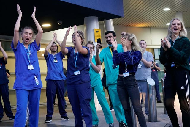 <p>NHS staff at the entrance of the Royal Liverpool Hospital take part in the Clap for Carers campaign during the first lockdown in 2020 (Getty)</p>