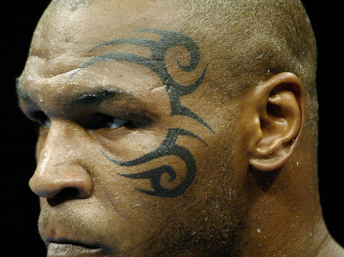 The controversial reason behind Mike Tyson's infamous face tattoo ...