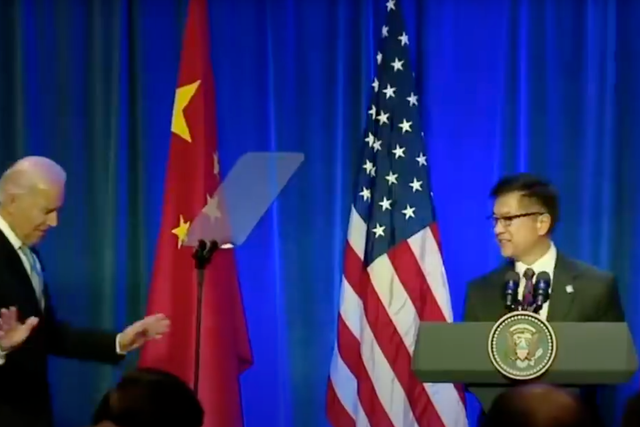 A still from the Trump 2020 re-election campaign ad 'Biden stands up for China', showing former Vice President Joe Biden sharing a stage with Chinese-American former governor of Washington state, Gary Locke.