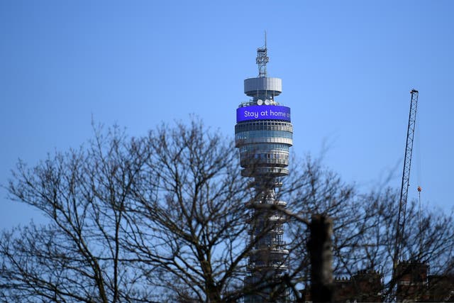 A message telling people to stay at home is seen on the BT Tower in London