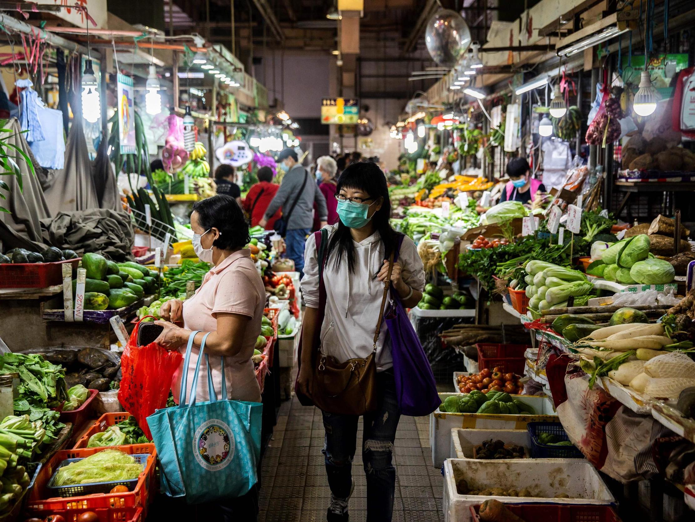 Shoppers at a wet market in Hong Kong on February 25, 2020