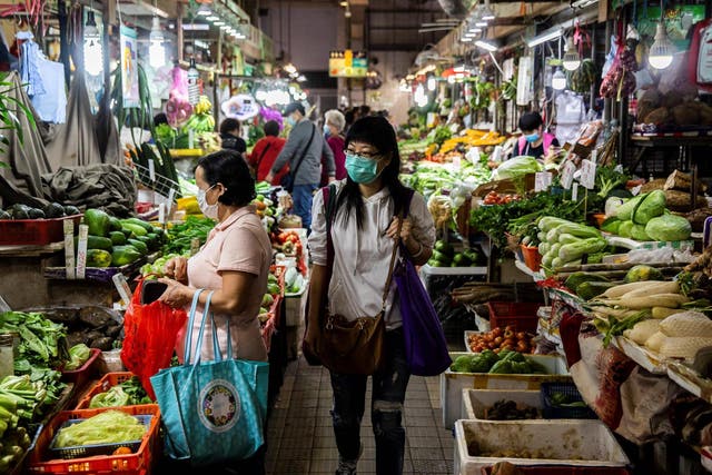 Shoppers at a wet market in Hong Kong on February 25, 2020