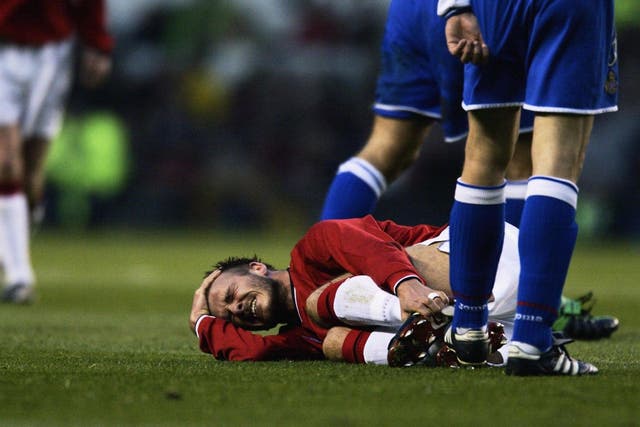 David Beckham lies injured playing against Deportivo in 2002