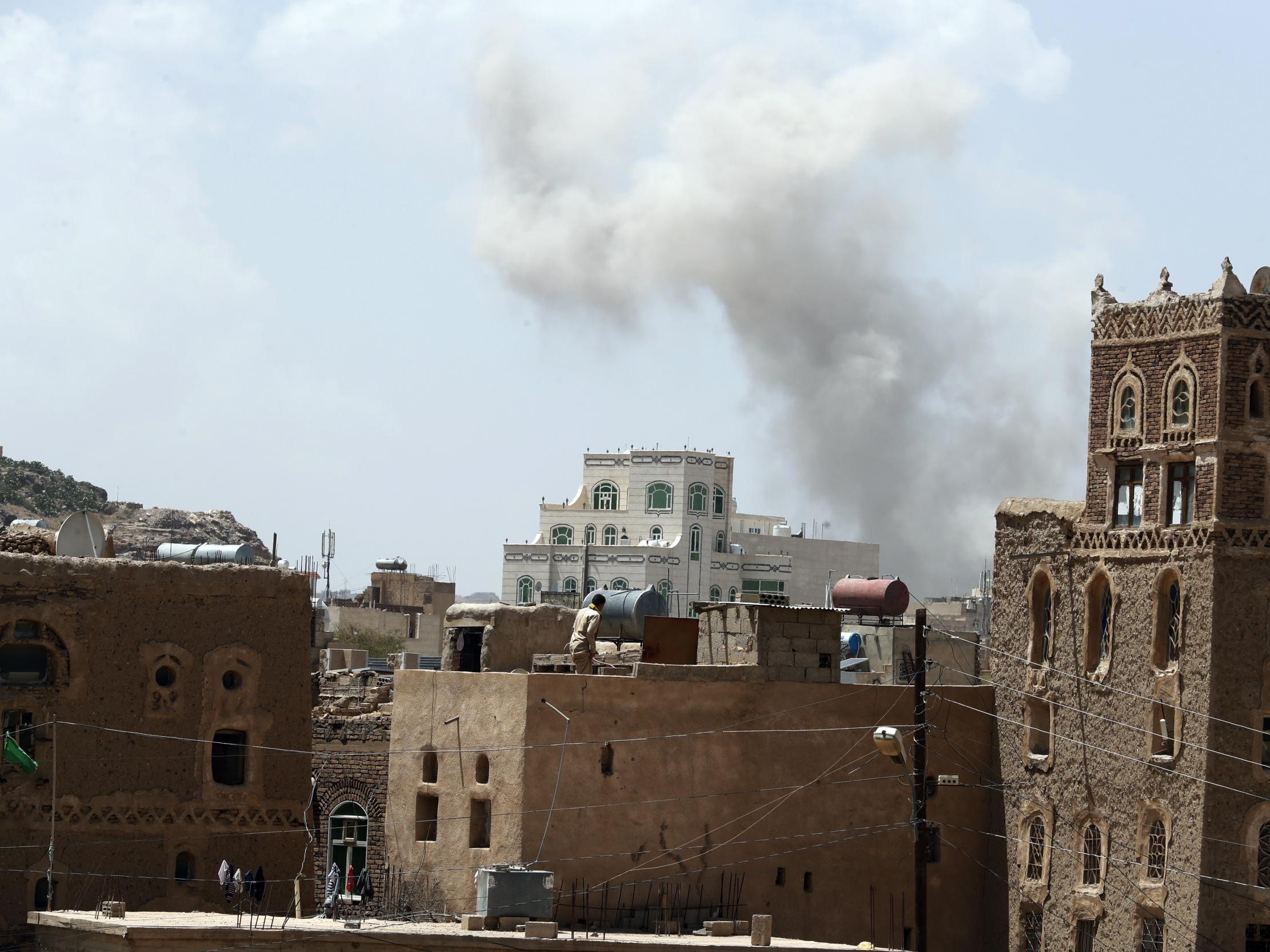 Smoke billowing above a neighbourhood in Sana’a following Saudi-led airstrikes