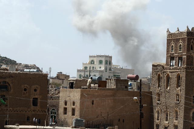 Smoke billowing above a neighbourhood in Sana’a following Saudi-led airstrikes