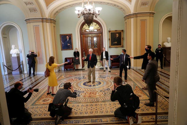 Senate Majority Leader McConnell speaks to members of the news media after departing from the Senate Chamber floor on Capitol Hill in Washington