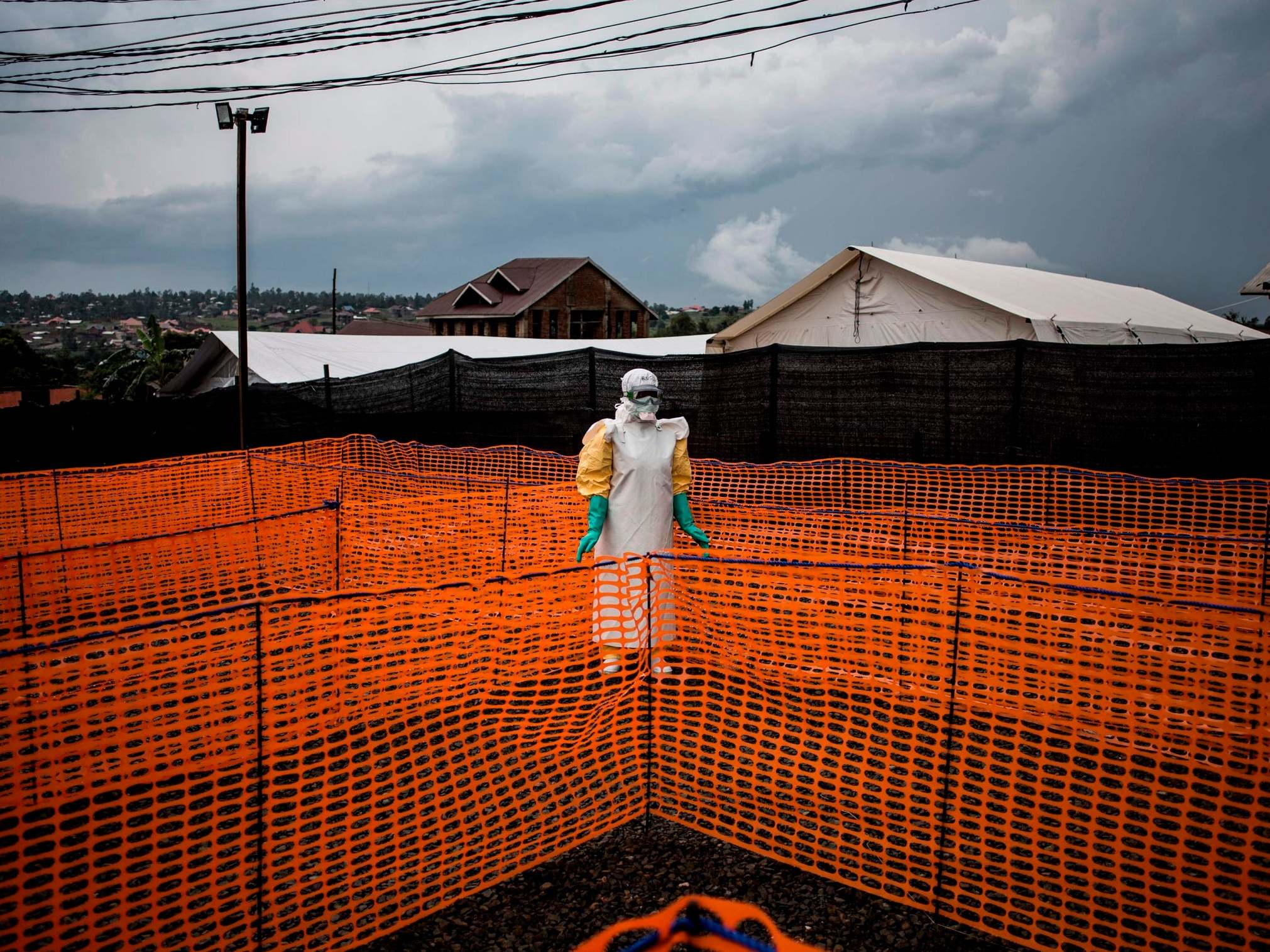 A health worker waits to handle a new unconfirmed Ebola patient at a Medicines Sans Frontiers treatment centre in the Democratic Republic of the Congo in 2018