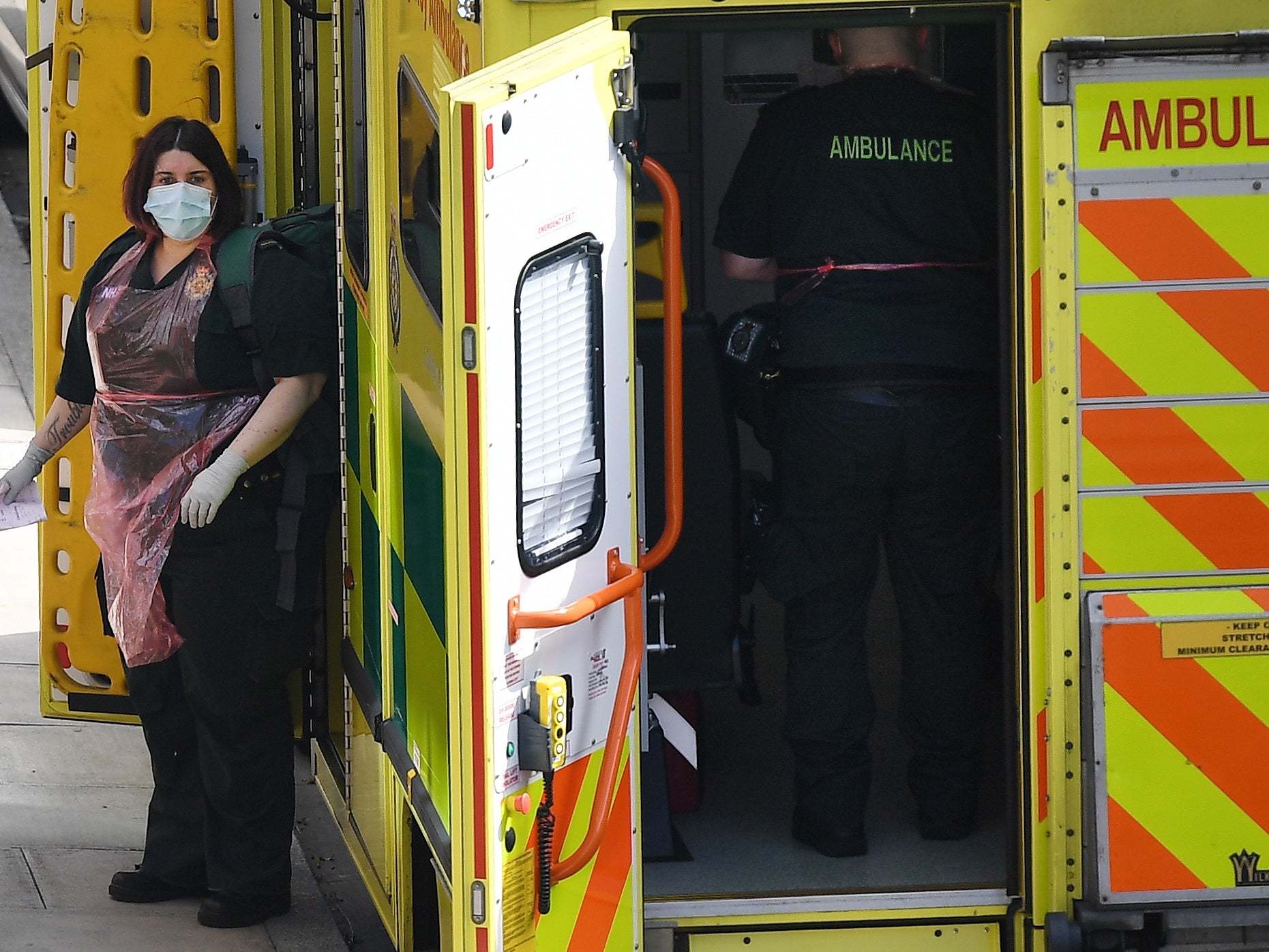 NHS ambulance staff arrive at a call out in London, Britain, 13 April, 2020