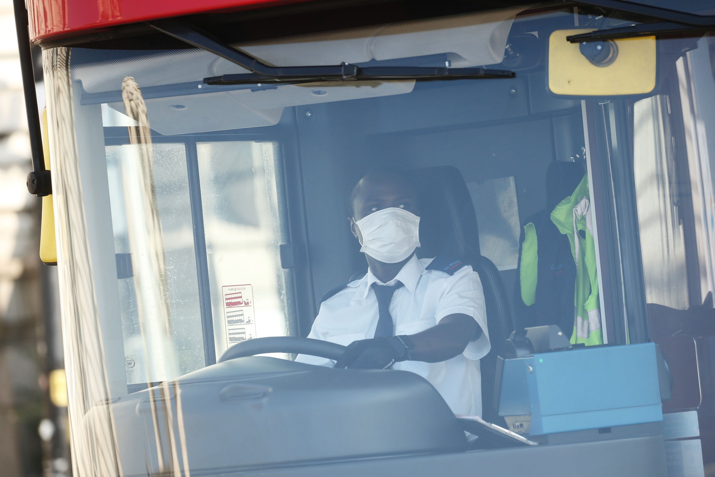 Bus drivers are among those who do not have to self-isolate after travelling abroad (AFP/Getty)