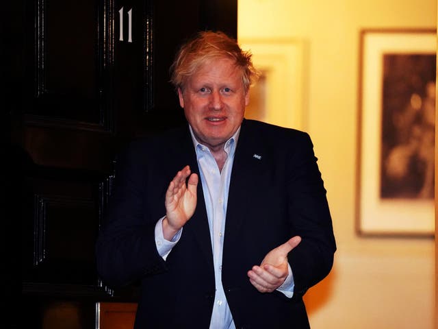 Boris Johnson applauds in support of the NHS during Clap for our Carers, outside 11 Downing Street