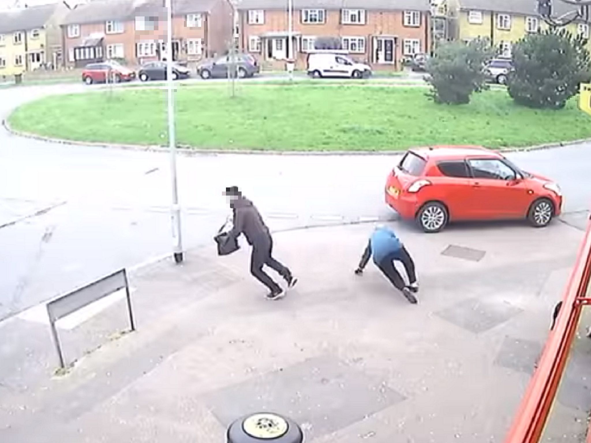 Screen grab from video showing man mugging woman in her 80s in Sittingbourne, Kent, 14 April 2020.