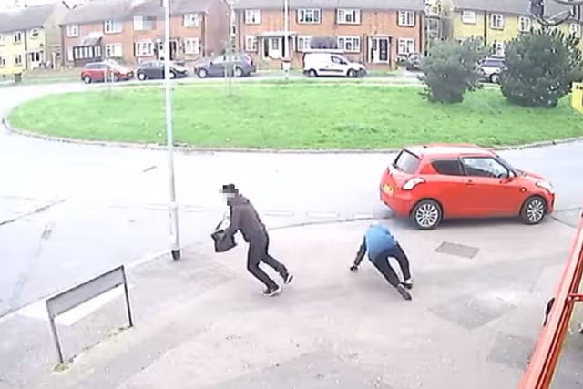 Screen grab from video showing man mugging woman in her 80s in Sittingbourne, Kent, 14 April 2020.