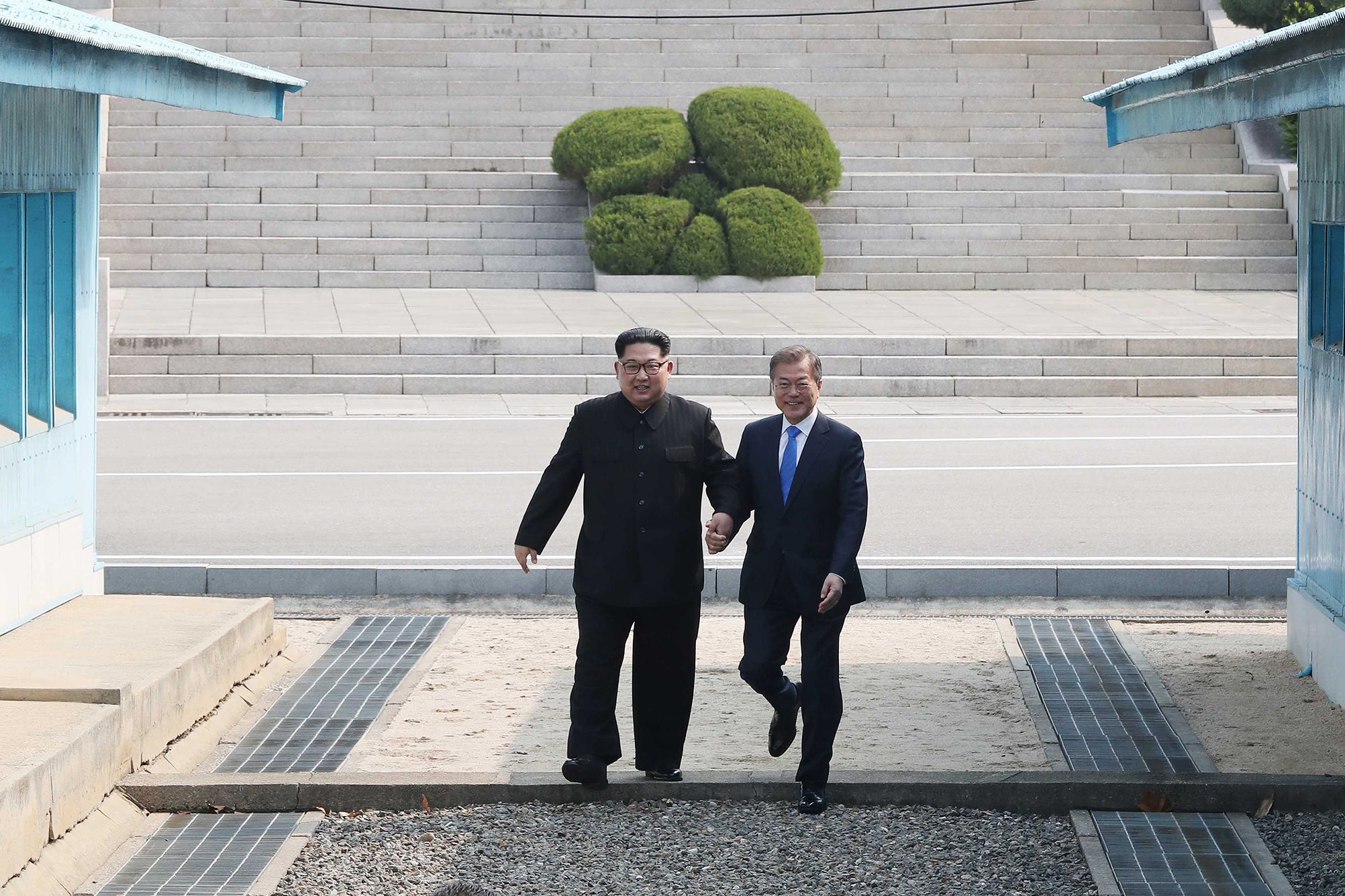 Kim Jong-un and South Korea’s president Moon Jae-in?step across the military line that divides their countries