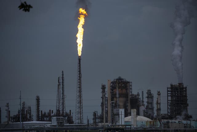 A gas flare from the Shell Chemical LP petroleum refinery lights up the sky in Norco, Louisiana.