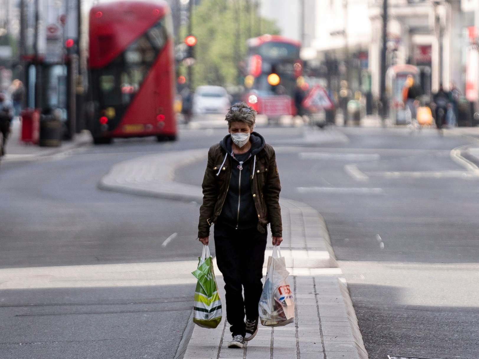 A lone shopper walks down central London’s Oxford Street in April